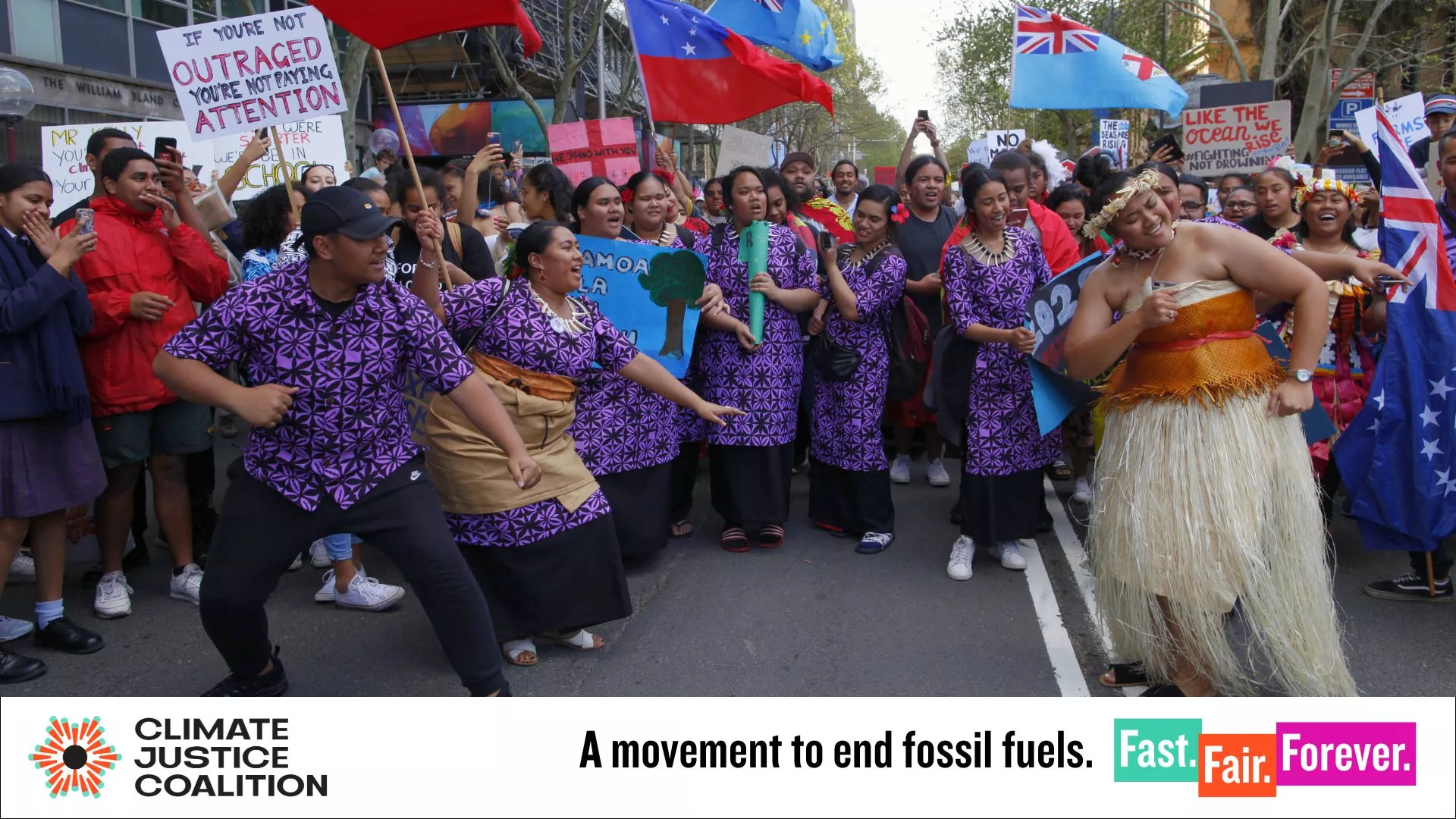 A screenshot from the CJC brand guide, which features a group of people dancing at a rally and CJC brand assets along the bottom.